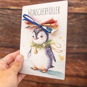 Geldgeschenk Postkarte zu Weihnachten mit Pinguin Motiv und Geldhalter