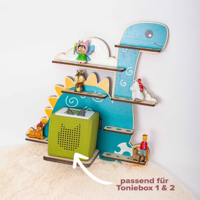 Wandregal für Tonieboxen aus Holz in Form eines türkisen Dinosauriers, passend für die Toniebox Generation 1 und 2, mit magnetischen Stellflächen für Tonie-Figuren.